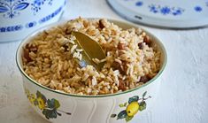 a bowl full of rice with a spoon in it