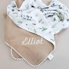 a blanket with the name eliot written on it