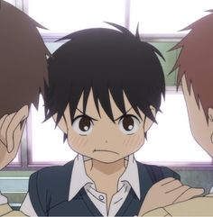 three anime characters are looking at something in front of the camera and one is holding his head