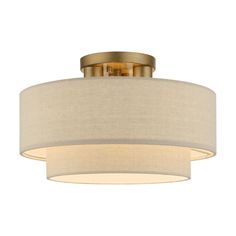 a light fixture with a beige shade on it