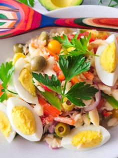 an egg salad is served on a white plate