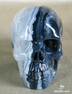 a glass skull sitting on top of a table