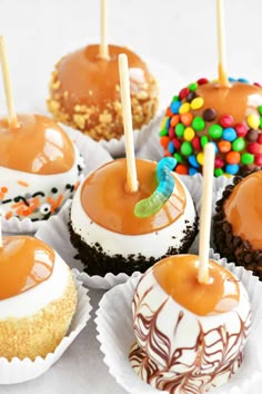 chocolate cupcakes with caramel and candy on top