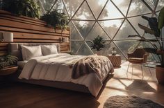 a bedroom with a bed and plants in the corner, next to a large window