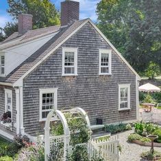 a house with a white picket fence around it