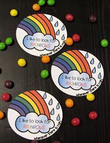 three stickers with rainbows and raindrops on them