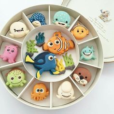 an assortment of sea animals in a white container