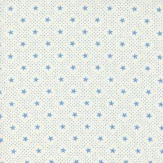 a blue and white background with small stars on the bottom half of the fabric, which is