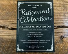 a black and white retirement party card on top of a wooden table