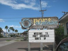 a welcome sign to port anansa's surfs up on the street