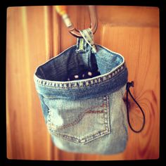 an old pair of jeans hanging from a hook