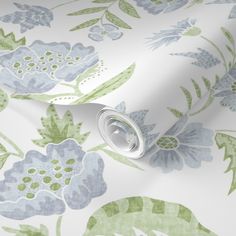 a floral wallpaper with blue and green flowers on white background, close up view