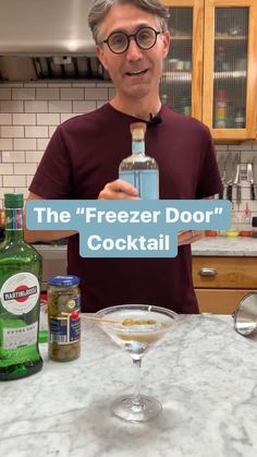 the freezer door cocktail is being held up by a man in a red shirt