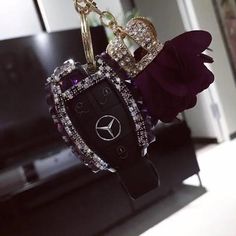 a car key chain with a mercedes logo on it