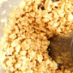 a food processor filled with oats and raisins being blended into something else