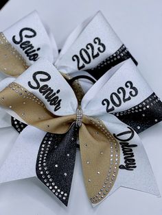 a white and black bow with the words class of 2013 printed on it's side