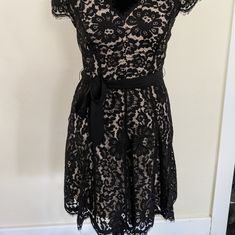 This Black Lace Dress Is Ready To Go To A Party! Never Worn, It Still Has Tags And Is Just Waiting For The Right Closet! Chic V-neck Lace Evening Dress, Evening Lace Midi Dress Fit And Flare, Fitted V-neck Lace Dress For Party, Chic A-line Lace Party Dress, Chic V-neck Lace Dress For Evening, Lace Midi Dress With V-neck For Party, Evening Lace Dress Fit And Flare A-line, Evening Fit And Flare A-line Lace Dress, Chic V-neck Lace Party Dress