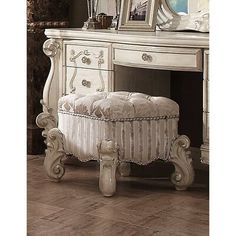 an antique white dressing table with mirror, stool and jewelry box on it's side