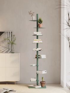 a book shelf with books and plants on it in a living room next to stairs