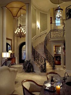 a living room filled with furniture and a spiral staircase