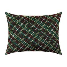 a green and red plaid pillow on a white background