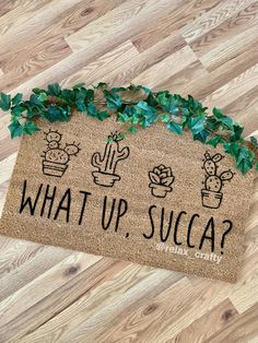 a welcome mat with the words what up, succ? written on it