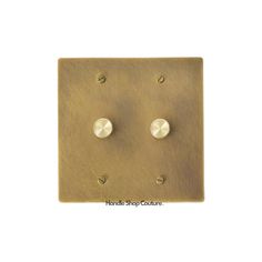 an antique brass light switch plate with two screws on the front and one in the back