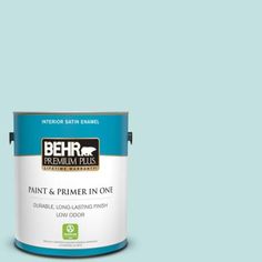 a can of behr premium plus paint and primer in one on a blue background