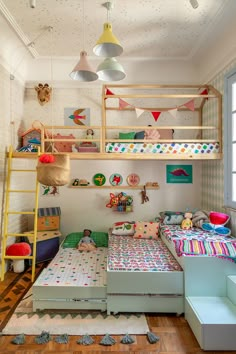 a child's bedroom with bunk beds and toys on the shelves above them,