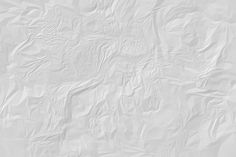 an abstract white background with wrinkled paper