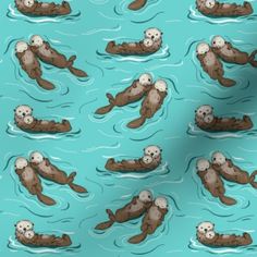 an image of otters swimming in the water