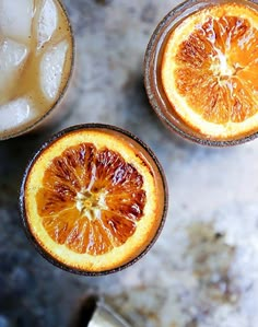 two glasses filled with ice and orange slices