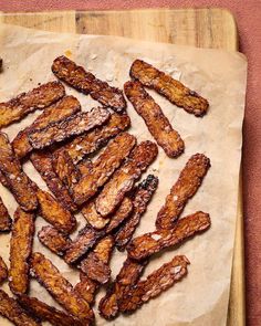 some fried food is sitting on a cutting board