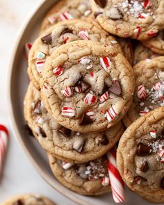 a plate full of cookies and candy canes