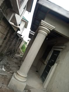 an old building with columns and a door