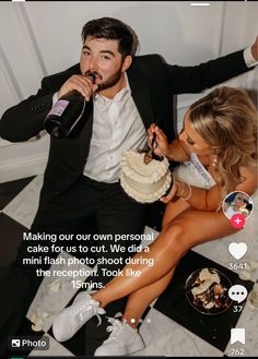 a man and woman sitting next to each other on a couch with a cake in front of them