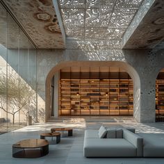 the interior of a modern building with large windows and wooden bookshelves on either side