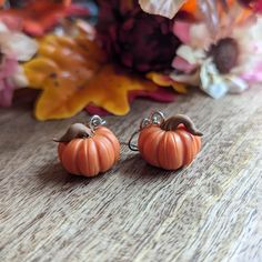 Nickel Free Lightweight and comfortable, these earrings weigh less than a quarter. Every pumpkin is sculpted by hand.  ▪CARE INSTRUCTIONS▪ Store in a clean dry area. Do not wear in water. Do not wear to bed. If dropped or bent, they may break. You may clean earrings with a soft wet towel. If you get a small stain on the earring, they may be cleaned with a small amount of nail polish remover on a cotton swab. Please note that these are handmade items, slight variation may occur compared to the pictures, you will not be receiving the exact pair in the image. Clean Earrings, Spooky Earrings, How To Clean Earrings, Halloween Baskets, Wet Towel, Cat Items, Polish Remover, Cotton Swab, Nail Polish Remover