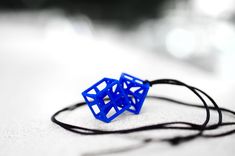 "3d printed blue pendant necklace; unisex mans and woman jewelry; gift for architecture designer student architect geometry teacher science math engineer dad mom fiance wife; geometric shape: cubic star twins hypercube. These two twin cubes are inseparable, forever connected to each other! They were 3d printed in one single process so they are connected to each other at one corner, but still they can mode in different directions! The geometric design of this very unusual pendant symbolizes \"con 3d Printed Pendant, Star Twins, Geometry Teacher, Teacher Science, Blue Pendant Necklace, Woman Jewelry, Blue Pendant, Architecture Student, 3d Printed