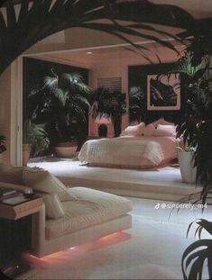 a bed room with two beds sitting next to each other and plants in the corner