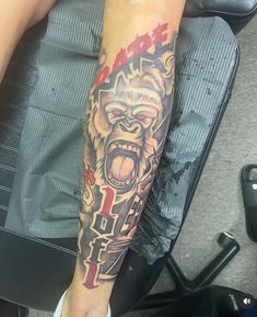 a man with a tattoo on his arm has a monkey in the middle of it