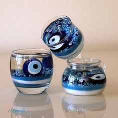 three glass bowls with blue and white designs on them