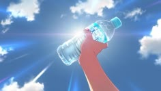 a hand holding a water bottle up to the sky with clouds and sun in the background