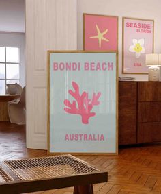 there is a sign that says bondi beach australia in pink and blue on the wall