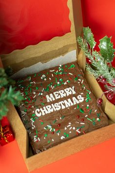 a christmas cake in a box on a table