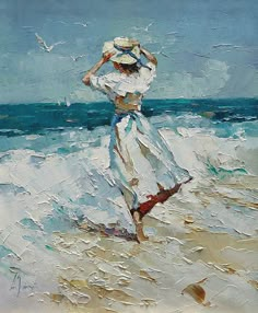 a painting of a woman walking on the beach with her hat in her hand and seagulls flying overhead