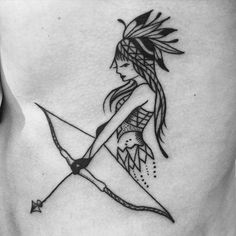 a woman with a bow and arrow tattoo on her stomach