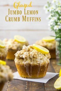 a close up of a muffin on a table with lemons in the background