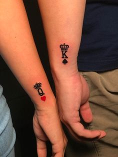 two people with matching tattoos on their arms