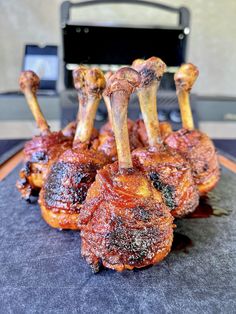 several pieces of meat sitting on top of a cutting board